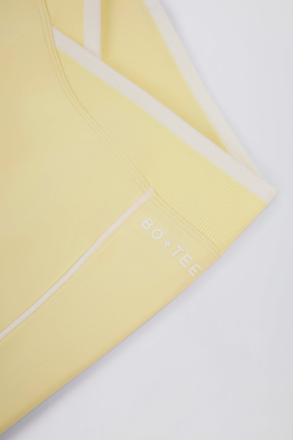 Chic Soft Active Wrapover Contrast Mini Shorts in Soft Yellow