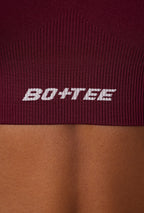 Chic Super Sculpt Seamless Cross Back Sports Bra in Plum
