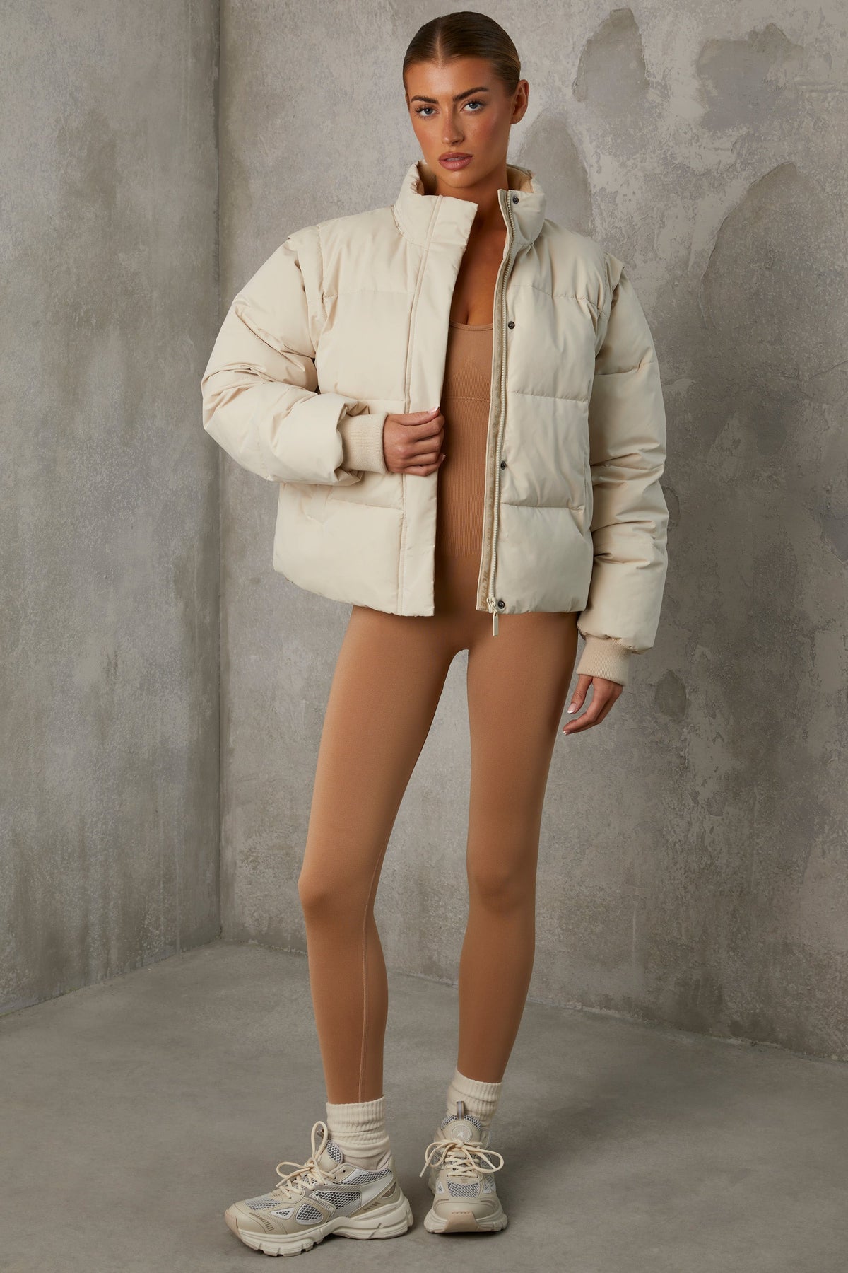 Chic Cropped Puffer Jacket with Detachable Sleeves in Sand