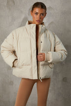Chic Cropped Puffer Jacket with Detachable Sleeves in Sand