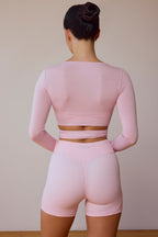 Chic Long-Sleeve Wrap Crop Top in Soft Pink
