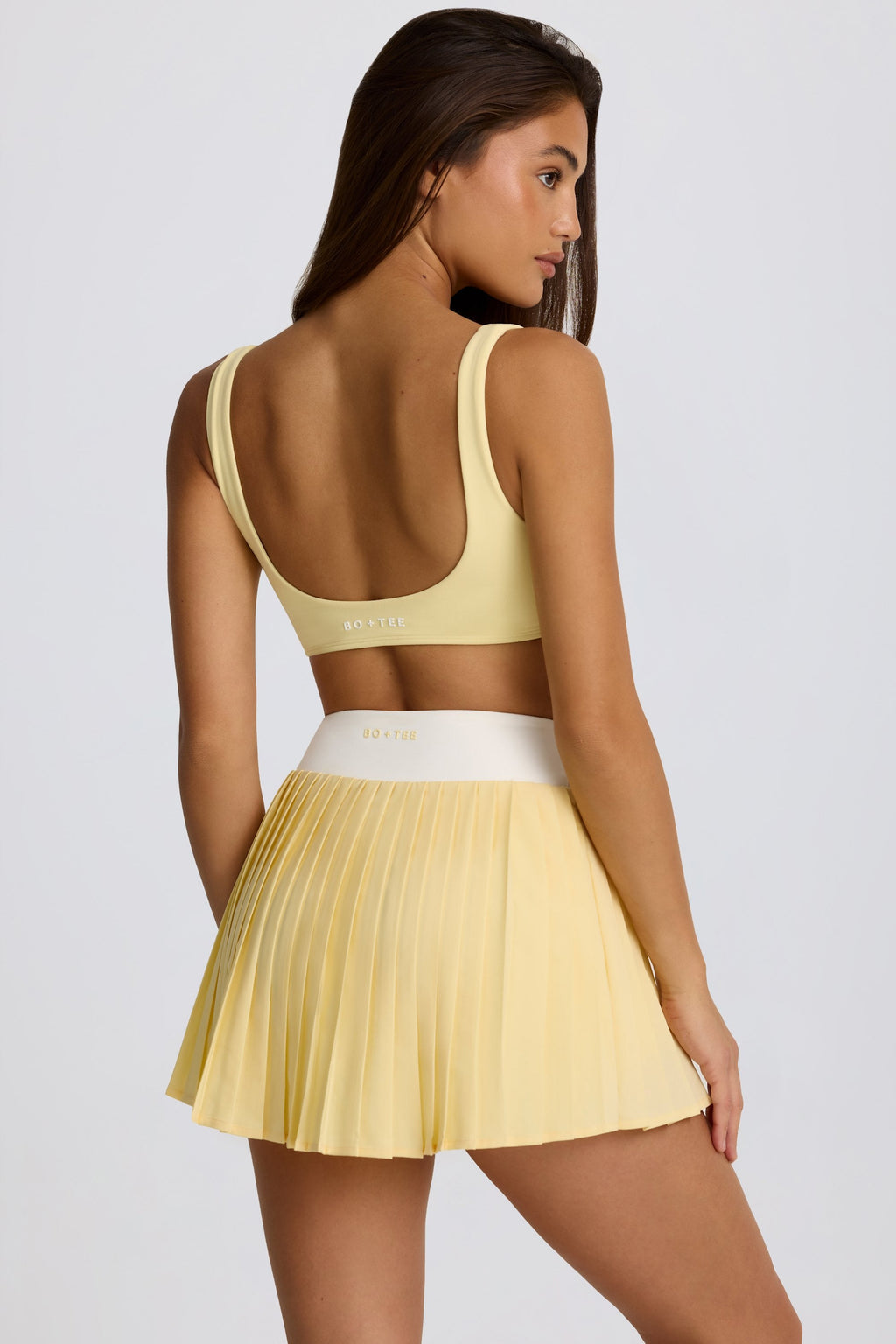 Chic Soft Active Crossover Pleated Mini Skort in Lemon