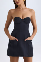 Chic Strapless Structured Tulip Mini Dress in Black