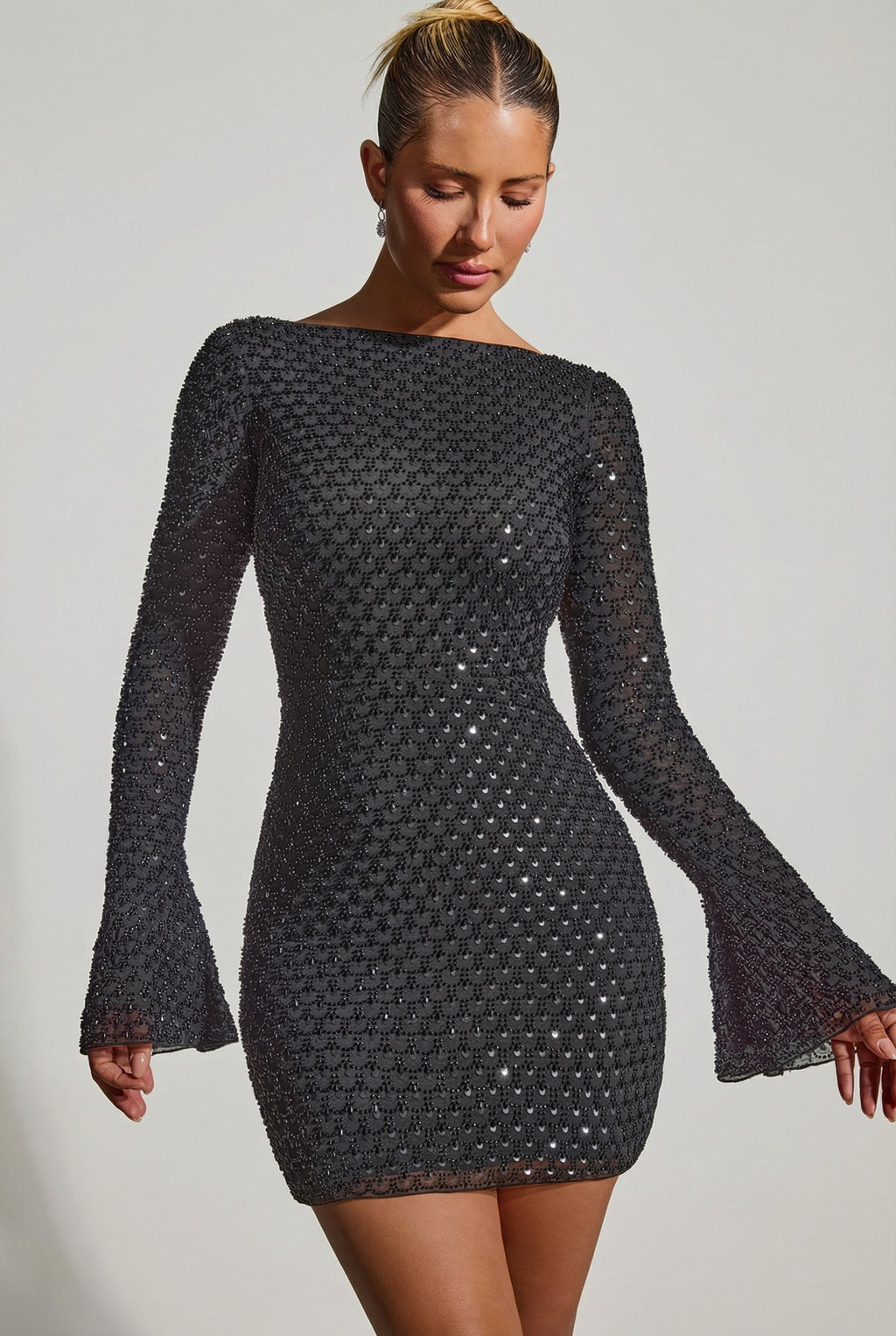 Chic Embellished Open-Back A-Line Mini Dress in Black