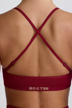 Chic Super Sculpt Seamless Cross-Back Sports Bra in Burgundy